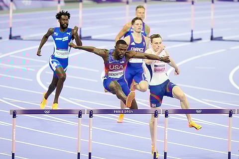 Athletes compete in the men's 400-meters hurdles final